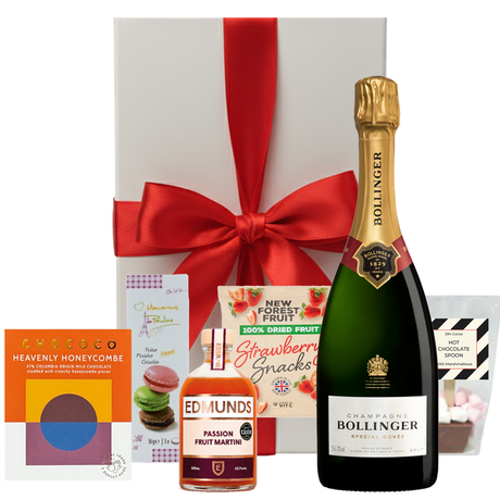 Bollinger Christmas hamper with festive treats in a white gift box with bow