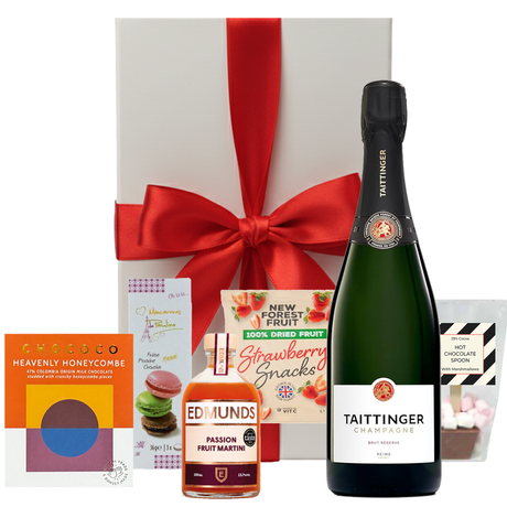 Taittinger Christmas hamper with festive treats in a white gift box with bow