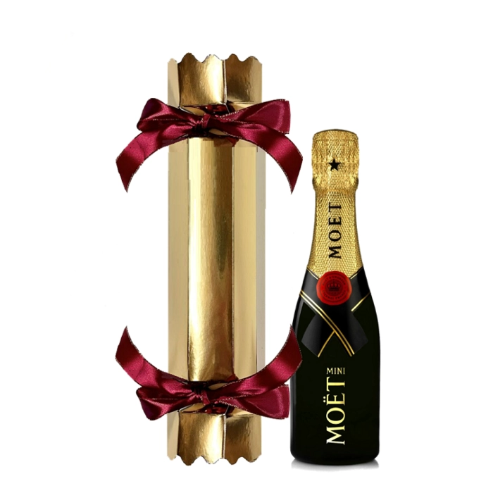 Mini Moët Champagne in a gold festive cracker tied with ribbon at both ends