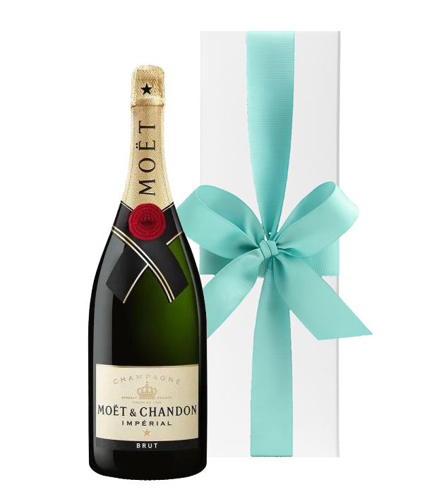 Moét & Chandon champagne bottle with a turquoise ribbon on a white background
