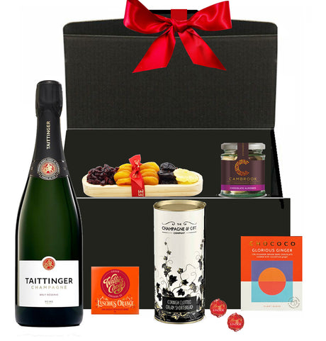Taittinger Christmas hamper with festive chocolates and treats in a luxury gift box with bow