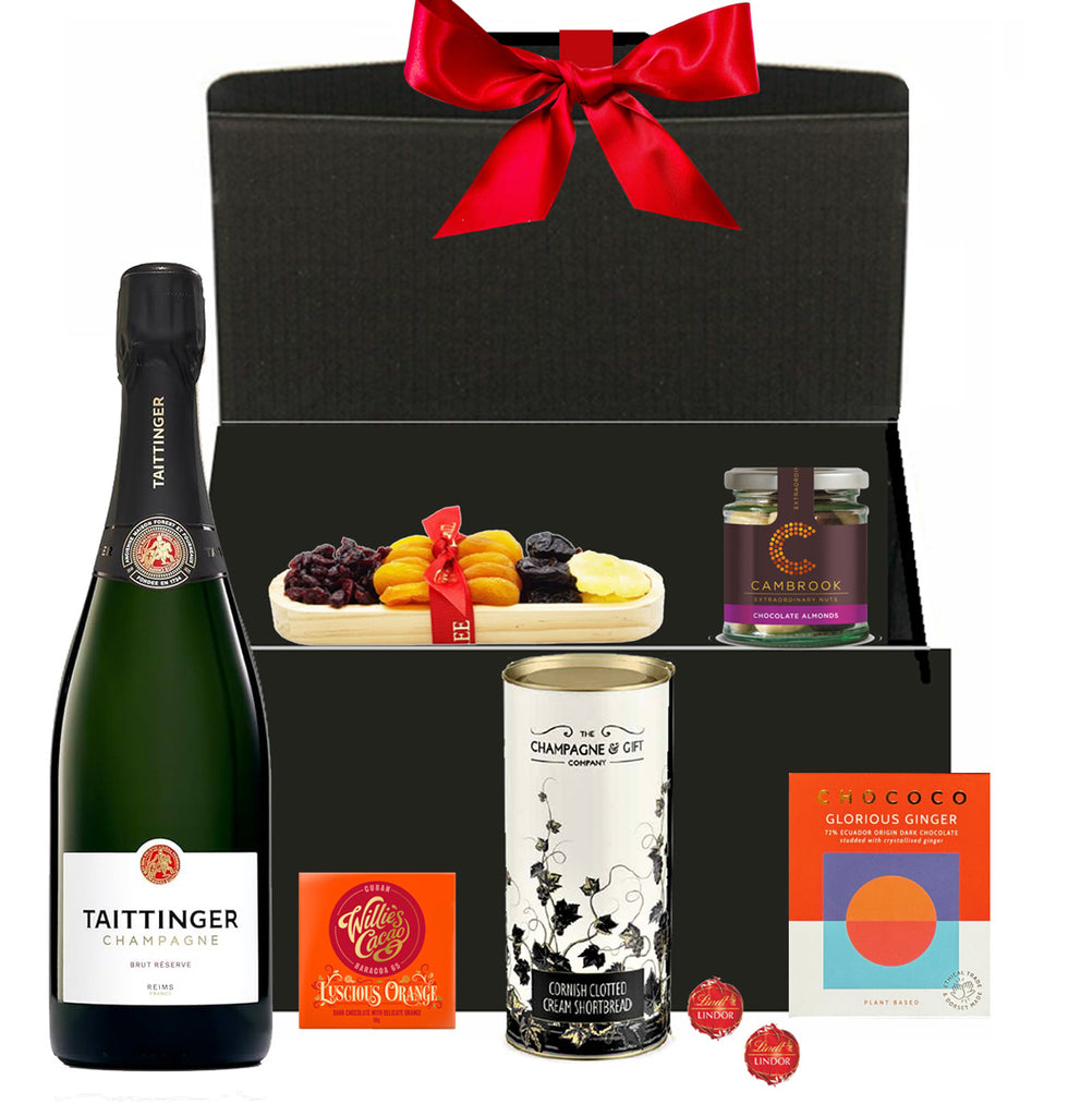 Taittinger Christmas hamper with festive chocolates and treats in a luxury gift box with bow