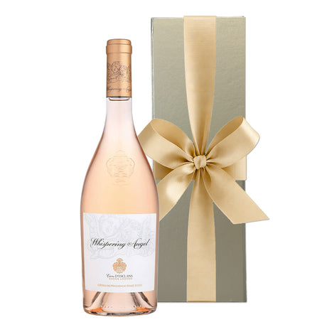 Whispering Angel rosé wine in a gold gift box with hand-tied ribbon.